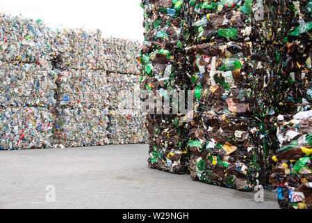Minsk, Belarus -June 6, 2019 A pile of extruded plastic bottles at a garbage collection plant. Sorting and recycling plastic. Stock Photo