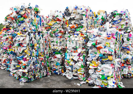 Minsk, Belarus -June 6, 2019 A pile of extruded plastic bottles at a garbage collection plant. Sorting and recycling plastic. Stock Photo