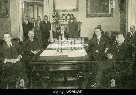 The caption of this photo that dates to 1923 reads: The Climax of the Arms Conference.  On August 17, 1923, the treaties negotiated at the Washington Conference became effective with the formal excahnge of ratifications in the diplomatic room of the State Department. Acting in behalf of the five powers were (left to right): Andre de la Boulaye (France); Henry G. Chilton (Britain); Charles Evans Hughes (Secretary of State for the United States); Augusto Rosso (Italy); and Masanao Hanihara (Japan). Stock Photo