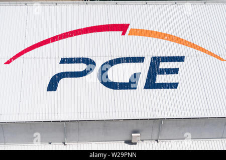 Solina, Poland - June 24, 2019: Polska Grupa Energetyczna (PGE) logo near Solina Dam in Poland. PGE Capital Group is Poland’s largest energy sector co Stock Photo