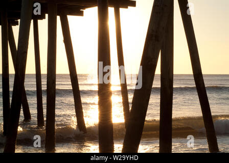 JETTY TO THE POINT: This all wooden construct stretches far out into the Atlantic ocean of Virginia beach. Stock Photo