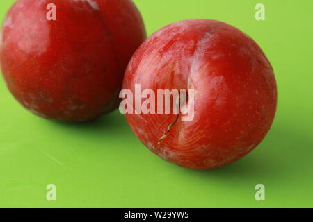 Delicious plums in colorful background Stock Photo