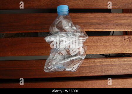 Empty plastic water bottle scaled for recycling Stock Photo