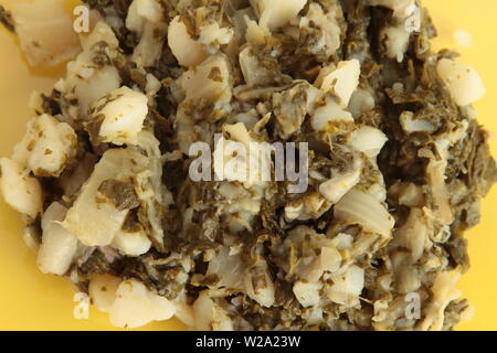 delicious chard with potato on yellow background Stock Photo