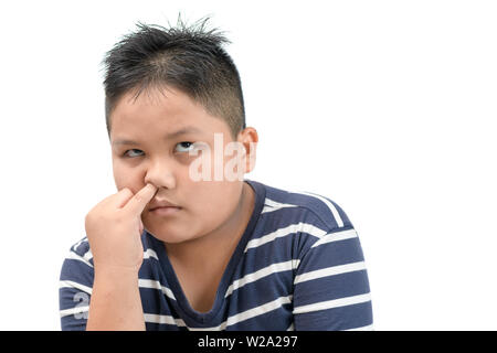 Obese fat boy pick his nose and bored isolated on white background, Health care and emotion concept Stock Photo