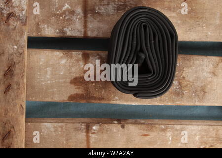 bicycle wheel camera on wooden background Stock Photo