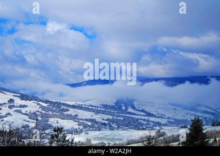View of the Carpathian mountains covered with snow in a winter sunny frosty day Stock Photo