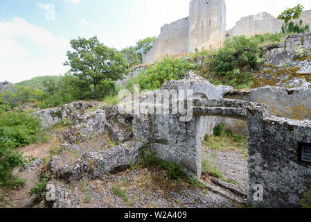 Ruins of Stone-Carved House & Ramports or Fort Wall Buoux Fort Luberon Provence france Stock Photo