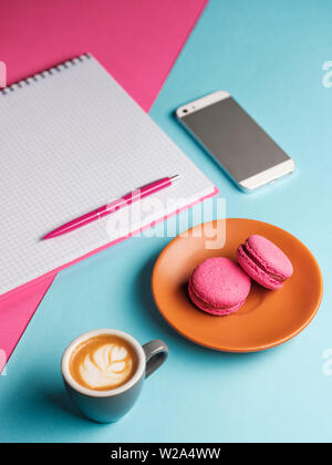 Coffee break in a colorful girly workspace Stock Photo