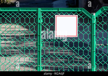 Closeup View Green Mobile Plastic Fence With Sign For Mockup Stock Photo