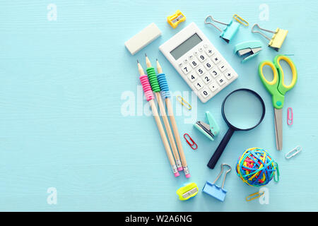 education and back to school concept. stationery over wooden blue background. top view, flat lay Stock Photo