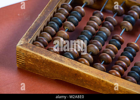 Vintage wooden abacus close up. Fragment of old abacus close up. Stock Photo