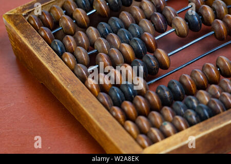 Vintage wooden abacus close up. Fragment of old abacus close up. Stock Photo