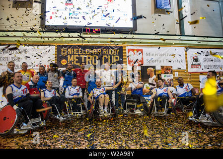 The French team celebrate their victory.The French National Team beat the Germans, 42:47 during the final and won the Metro Cup for the second time. The Metro Cup is the largest international Wheelchair Rugby Tournament in Poland. On 4-6 July 2019, the seventh edition of this event was held at the Ursynów Arena in Warsaw. Wheelchair rugby is a Paralympic sports discipline for people with spinal cord injury in the cervical segment and people with leg disorders. Stock Photo