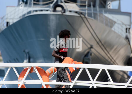 Floriana, Malta. 7th July, 2019. A rescued migrant disembarks in Floriana, Malta, on July 7, 2019. A group of 58 migrants was rescued by the Armed Forces of Malta (AFM) on Sunday morning. Credit: Jonathan Borg/Xinhua/Alamy Live News Stock Photo