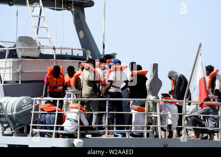 Floriana, Malta. 7th July, 2019. Rescued migrant wait for disembarkation in Floriana, Malta, on July 7, 2019. A group of 58 migrants was rescued by the Armed Forces of Malta (AFM) on Sunday morning. Credit: Jonathan Borg/Xinhua/Alamy Live News Stock Photo