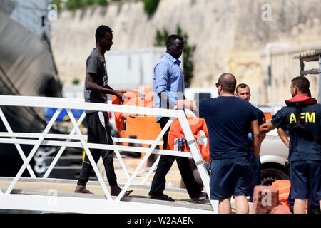 Floriana, Malta. 7th July, 2019. Rescued migrants disembark in Floriana, Malta, on July 7, 2019. A group of 58 migrants was rescued by the Armed Forces of Malta (AFM) on Sunday morning. Credit: Jonathan Borg/Xinhua/Alamy Live News Stock Photo