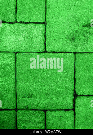 Vertical background with geometric pattern of highly detailed street pavement made of various square blocks. Textured rough surface toned in electric Stock Photo