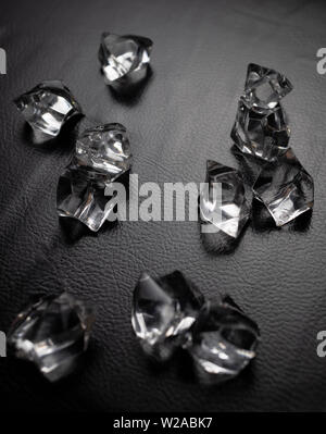 Crystals on the black leather Stock Photo