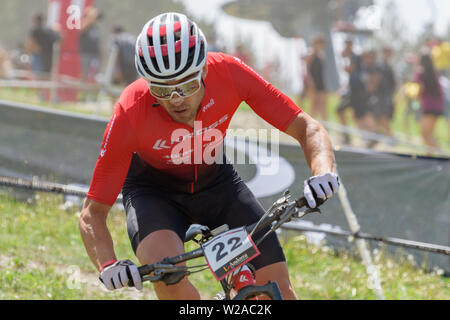 VALLNORD, ANDORRA  - JULY 7 2019:  CYCLIST in the MERCEDES-BENZ UCI MTB WORLD CUP 2019 - XCO Vallnord, Andorra on July 2019 Stock Photo