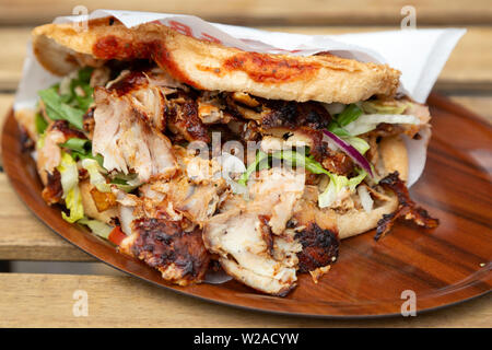 Vegetarian cuisine served in Berlin, Germany. The dish features an avocado cream sprinkled with seasonaing and topped with apple sticks. Stock Photo