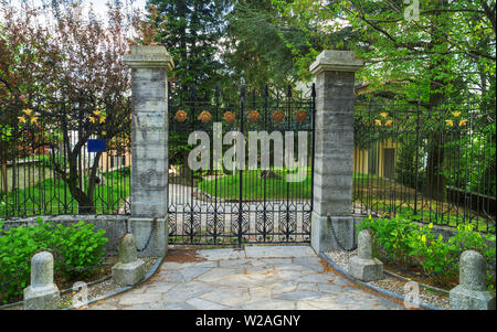 Carved metal gates. The concept of private property. Stock Photo