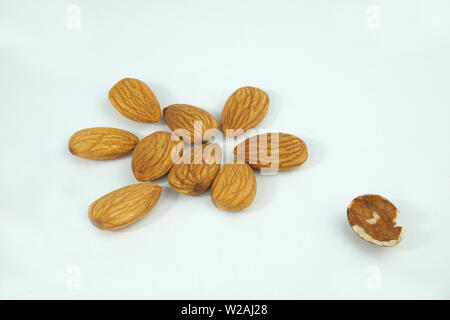 good and bad almonds isolated on white background
