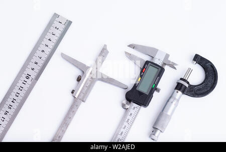 The image shows different measuring tools isolated on white Stock Photo