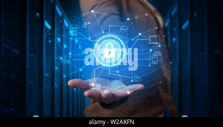 Man holding hologram projection displaying cloud technology symbols Stock Photo