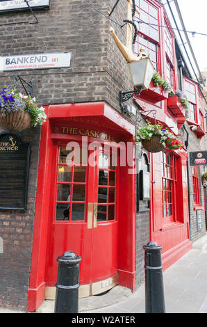 LONDON ENGLAND - JULY 16 2013;  Historic red windows and brick architecture of historic pub The Anchor on London's Southwalk with street sign Bankend Stock Photo