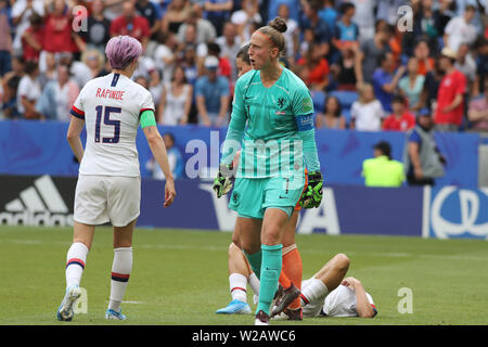 Groupama Stadium, Lyon, France. 7th July, 2019. FIFA Womens World Cup final, USA versus Netherlands; 17 Tobin Heath (USA) on the pitch, Sari Van Veenendaal (NED) reacts after contact on a cross as Megan Rapinoe (USA) comes in Credit: Action Plus Sports/Alamy Live News Stock Photo