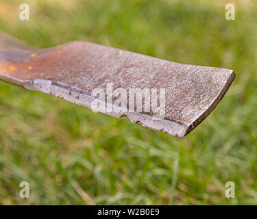 Lawn mower blade that is rusty, damaged, and dull and needing sharpened ...