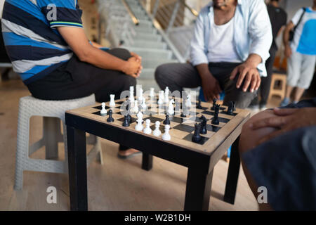 Samos, Samos, Greece. 28th June, 2019. Migrant play chess at a centre for residents on Samos.Samos Island is one of Europe's migrant hotspots acting as a reception and identification centre (RIC). It was established as a temporary accommodation site where migrants could be processed before moving to a refugee camp on the mainland. However, due to the continued number of arrivals, the mainland camps are full and so migrants are being left at the islands. The conditions are inhuman as the Central Government has for several years ignored requests from the municipality for assistance for the i Stock Photo