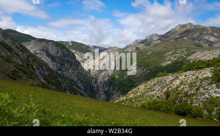 Limestone hills above an alpine pasture above the village of Bejes in Picos de Europa National Park, Spain Stock Photo