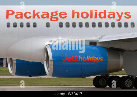 The logo of Jet 2 Holidays is clearly seen on the side of an air inlet at Manchester Airport, UK. Stock Photo