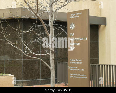 side on view of a sign in front of the fbi building in washington Stock Photo