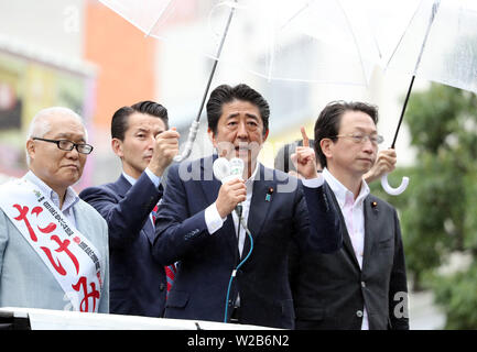 Tokyo, Japan. 7th July, 2019. Japanese Prime Minister and leader of the ruling Liberal Democratic Party (LDP) Shinzo Abe delivers a campaign speech for his party candidate Keizo Takemi (L) for the July 21 Upper House election in Tokyo on Sunday, July 7, 2019. Credit: Yoshio Tsunoda/AFLO/Alamy Live News Stock Photo