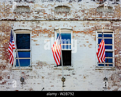 American flags hang from the windows of a historic building, Sept. 12, 2015, in Memphis, Tennessee. Stock Photo