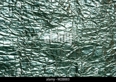 Close up texture of crumpled silver foil paper. Stock Photo