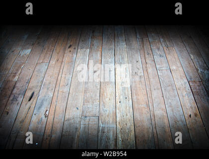light from ligther on dark fwood loor background for suspense text present Stock Photo