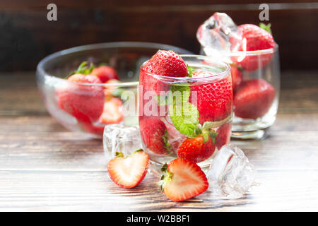 fresh Strawberry mohito cocktail with ice and mint in glass fruit to make water in the summer. Stock Photo