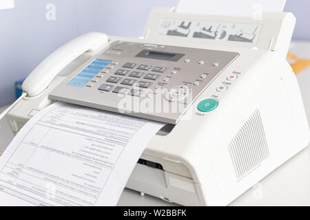 The fax machine for Sending documents in the office concept equipment needed in office Stock Photo