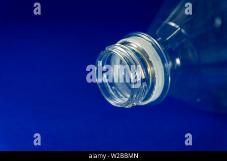 Close up of transparent white used plastic water bottle neck, recycling and food storage concept Stock Photo
