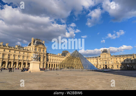 PARIS, FRANCE - APRIL 4, 2019: Paris France city skyline at Louvre Museum Pyramid Stock Photo