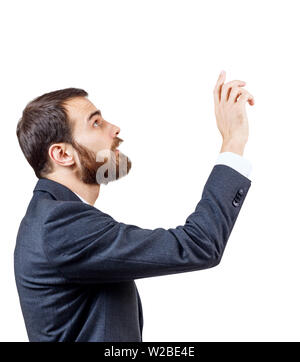 Businessman pointing to something or touching by forefinger. Stock Photo