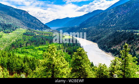 Rugged Mountains along the Fraser River where the Lytton-Lillooet Highway 12 follows this Mighty Fraser River for a scenic drive through BC, Canada Stock Photo