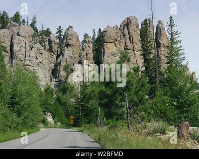 Scenic drive in South Dakota with a view of granite mountains and rock formations along Needles Highway. Stock Photo