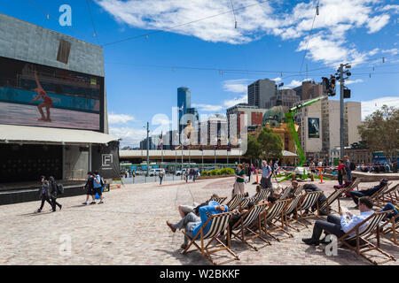 Australia, Victoria, VIC, Melbourne, Federation Square, watching the Olympics, NR Stock Photo