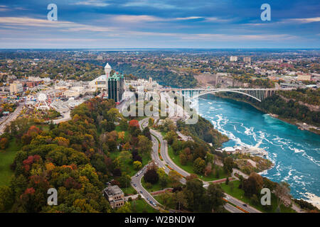 Canada and USA, Ontario and New York State, Niagara, View over Victoria Park towards the Sheraton on the Falls Hotel and Rainbow Bridge Stock Photo