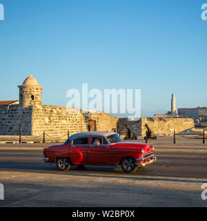 Car driving past the Castillo de San Salvador de la Punta, Havana, Cuba Stock Photo